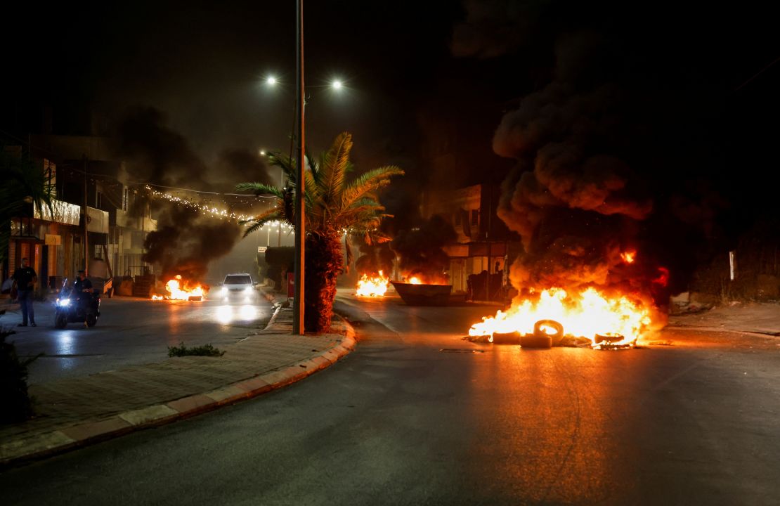 Tires were set on fire on a street during the attacks on Jenin.