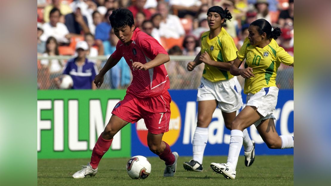 Korea Republic forward Eun Sun Park drives around Brazil forward Marta Sunday.  Brazil  defeated  the Korea Republic  3 - 0 in the opening round of the FIFA Women's 2003 World Cup