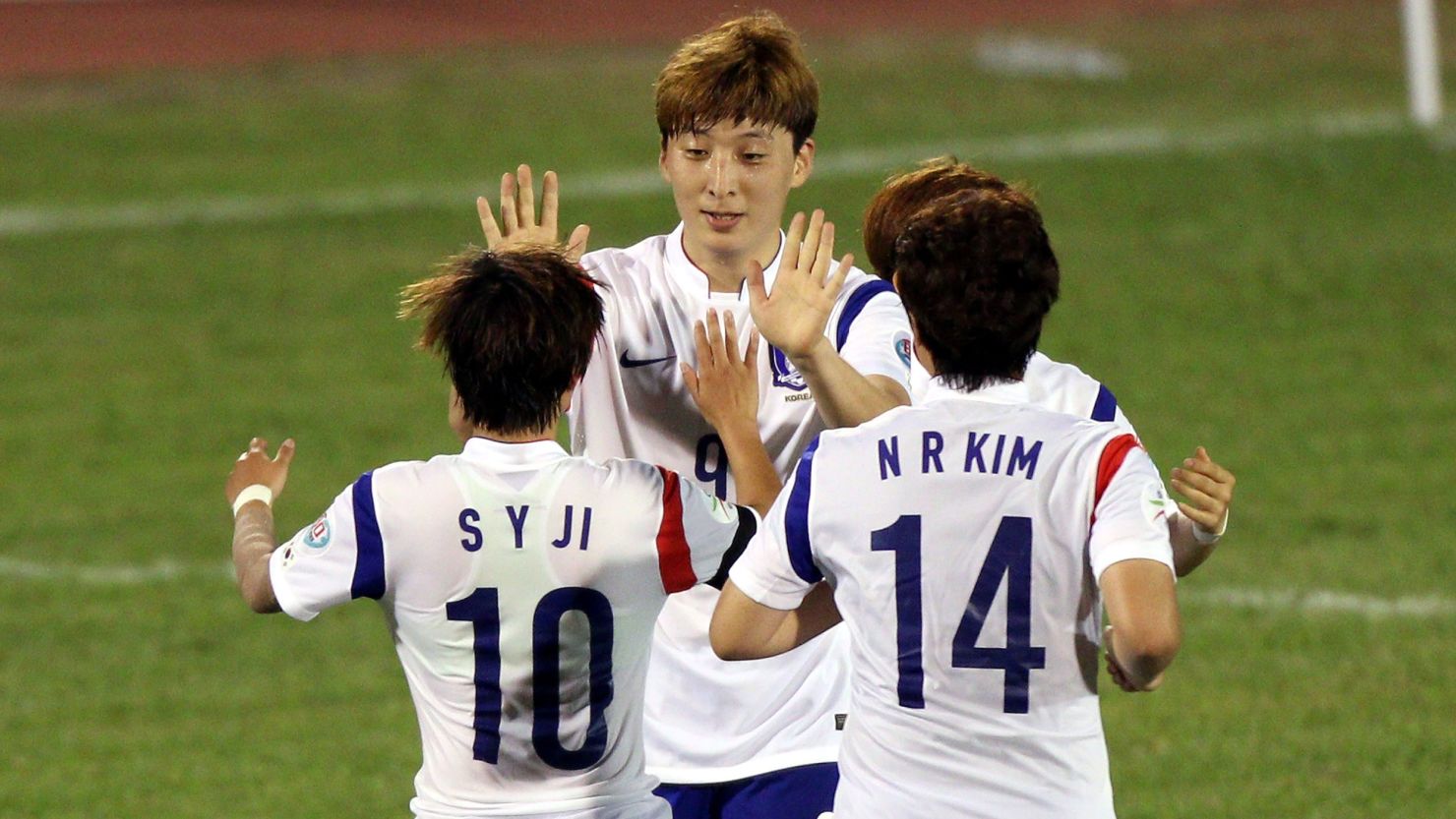 HO CHI MINH CITY, VIETNAM - MAY 17:  Park Eun Sun #9 of Korea Republic celebrates with team-mates after scoring against Thailand during the AFC Women's Asian Cup Gropu B match between Thailand and Korea Republic at Thong Nhat Stadium on May 17, 2014 in Ho Chi Minh City, Vietnam.