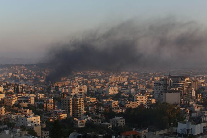 Smoke rises from buildings in Jenin on Monday.