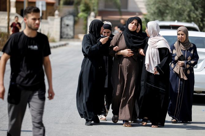 Palestinian women react Monday during the Israeli military operation in Jenin.