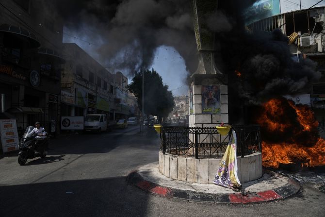 Tires burn in the Jenin refugee camp on Monday.