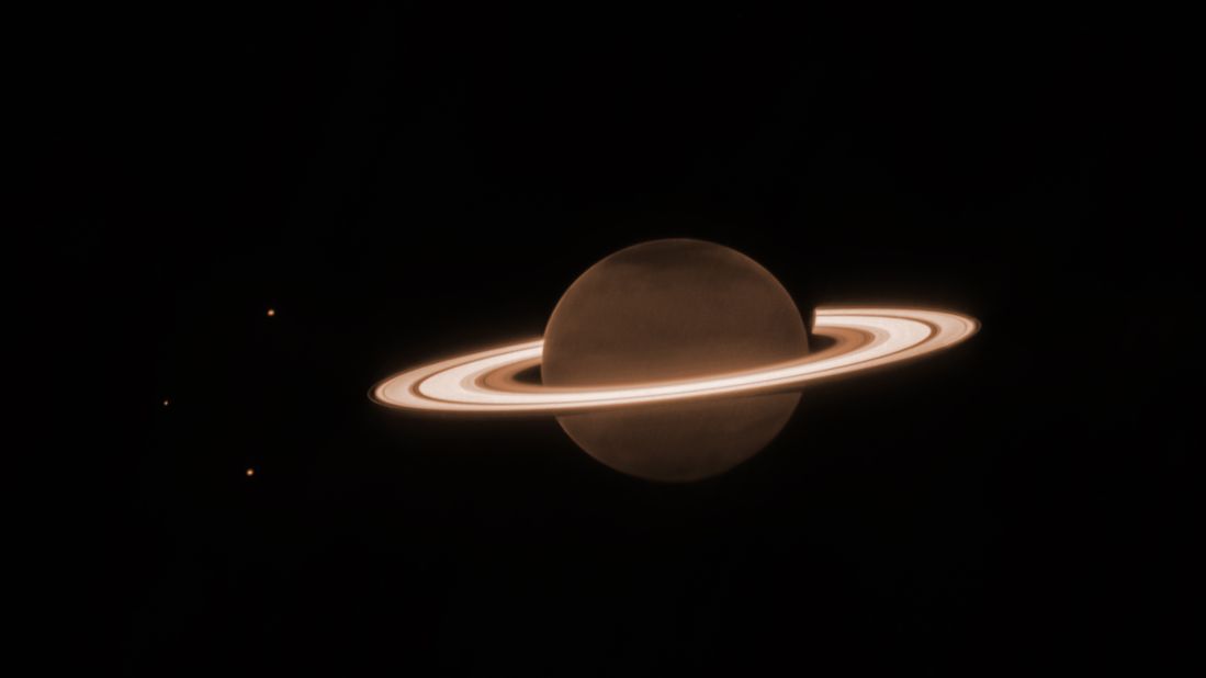 Saturn and its moons were captured by NASA's James Webb Space Telescope June 25. The image shows details of the planet's atmosphere and ring system. 