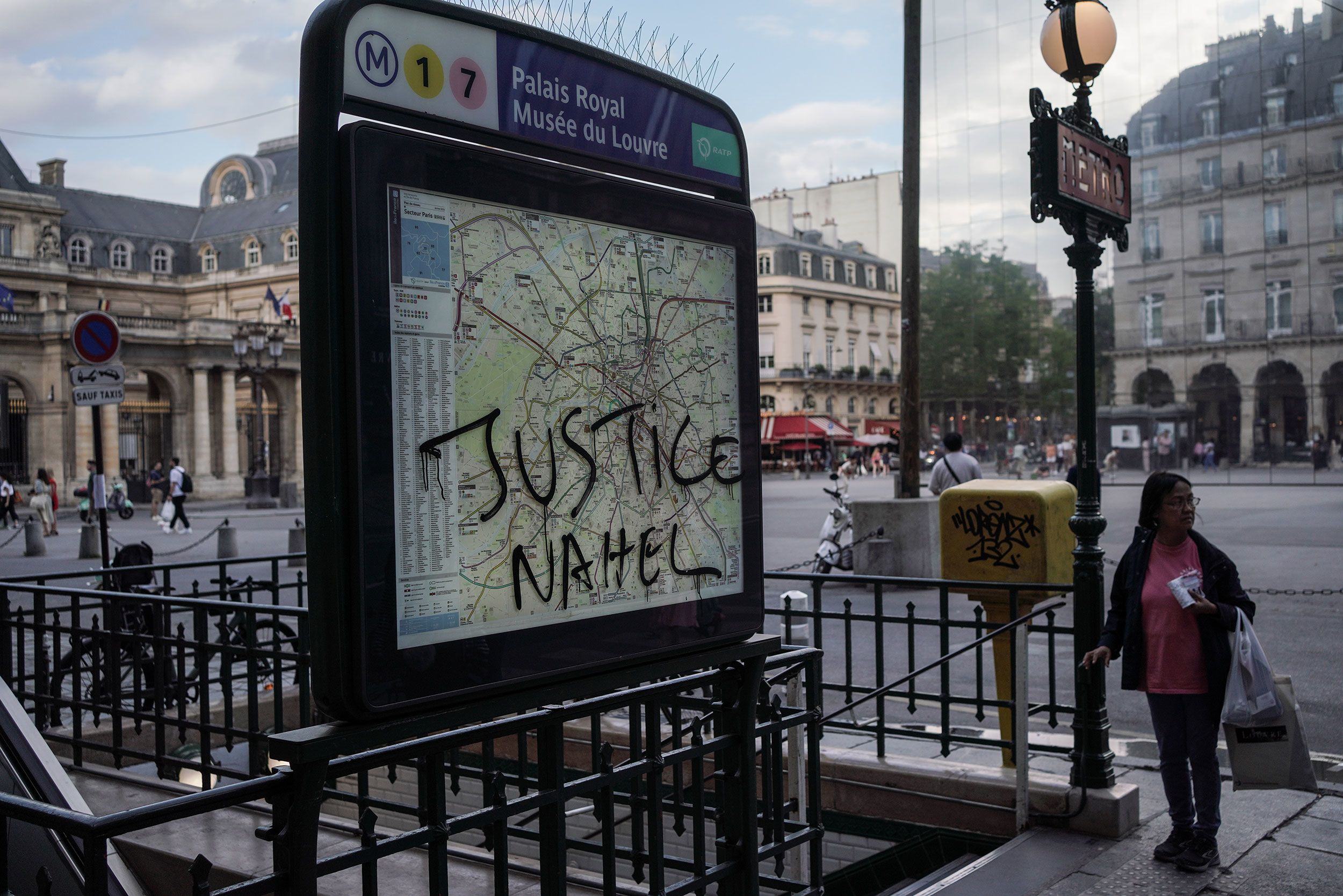 Justice Nahel is scrawled on a metro sign in Paris on July 2.