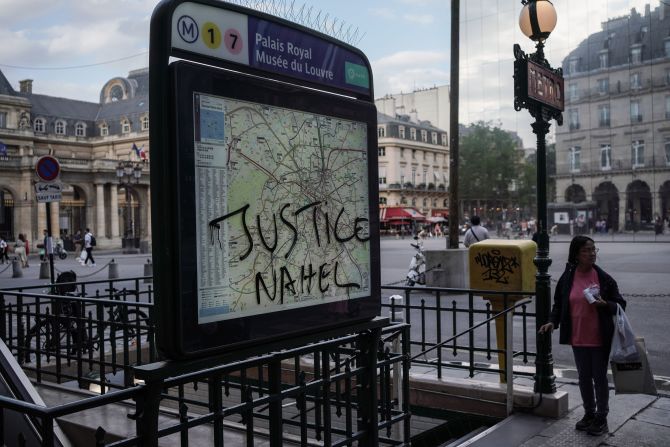 "Justice Nahel" is scrawled on a metro sign in Paris on July 2.