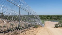 A razor wire fence is pictured next to the Rio Grande River in Eagle Pass, Texas on June 16, 2023. (Photo by SUZANNE CORDEIRO / AFP) (Photo by SUZANNE CORDEIRO/AFP via Getty Images)