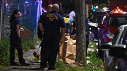 PHILADELPHIA, PENNSYLVANIA - JULY 3: Police place a rifle in a bag on the scene of a shooting on July 3, 2023 in Philadelphia, Pennsylvania. Early reports say the suspect is in custody after shooting 6 people in the Kingsessing section of Philadelphia on July 3rd. (Photo by Drew Hallowell/Getty Images)