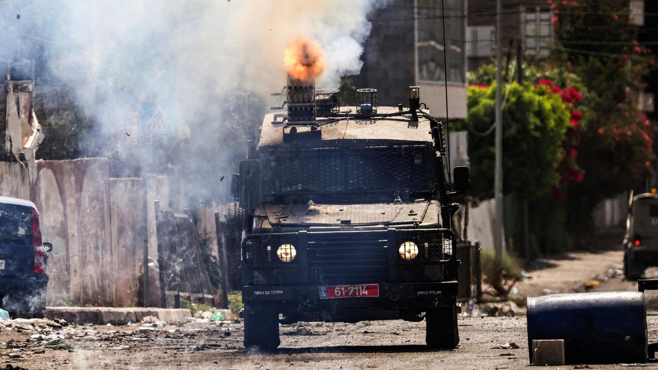 An Israeli armored vehicle fires tear gas during the military operation in Jenin in the occupied West Bank on July 4.