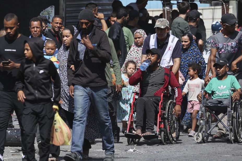 People flee the Jenin refugee camp on Tuesday.
