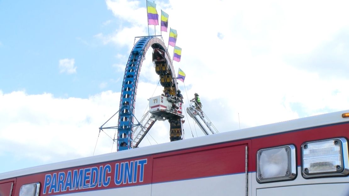 Emergency personnel work to remove people from a stuck roller coaster in Crandon, Wisconsin, on July 2.
