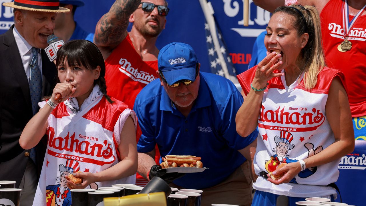 Mayoi Ebihara and Miki Sudo compete in the Nathan's hot dog eating contest on Tuesday.