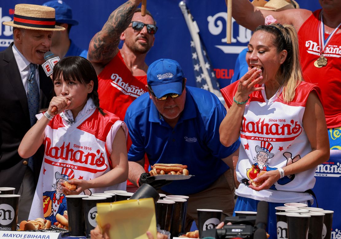 Mayoi Ebihara and Miki Sudo compete in the Nathan's hot dog eating contest on Tuesday.