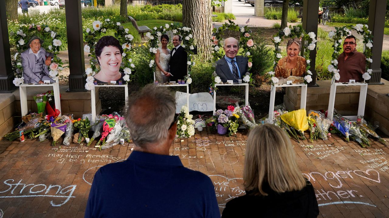 Mourners on July 7, 2022 visit memorial for victims of a mass shooting at a Fourth of July parade in the Chicago suburb of Highland Park, Illinois.