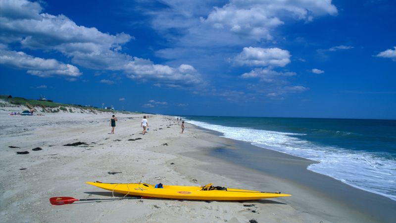 NextImg:A man swimming at a Long Island beach was bitten, possibly by a shark, police say | CNN