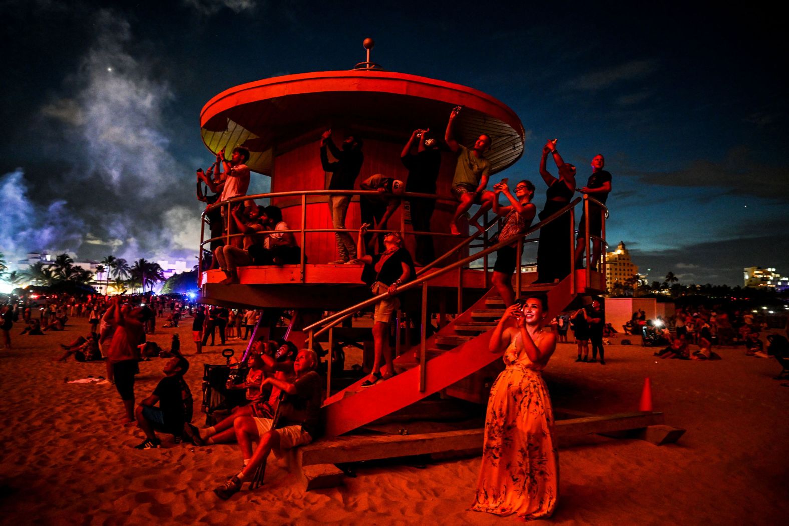 People gather to watch fireworks on South Beach in Miami Beach, Florida, on Tuesday.