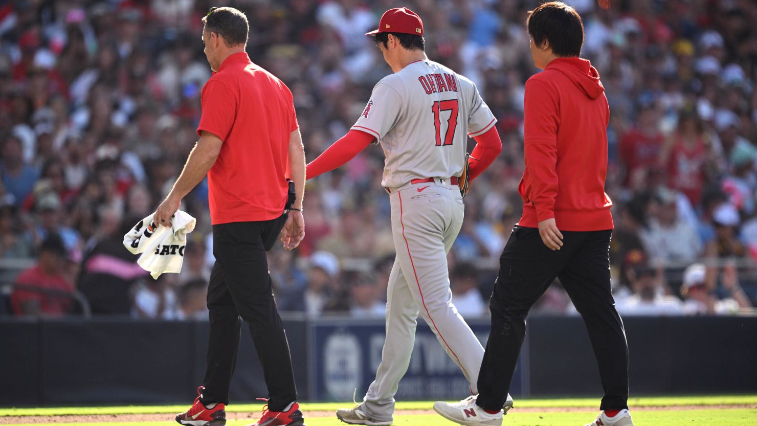 SAN DIEGO, CALIFORNIA - JULY 04: Shohei Ohtani #17 of the Los Angeles Angels walks to the dugout after being replaced during the sixth inning against the San Diego Padres at PETCO Park on July 04, 2023 in San Diego, California. (Photo by Orlando Ramirez/Getty Images)