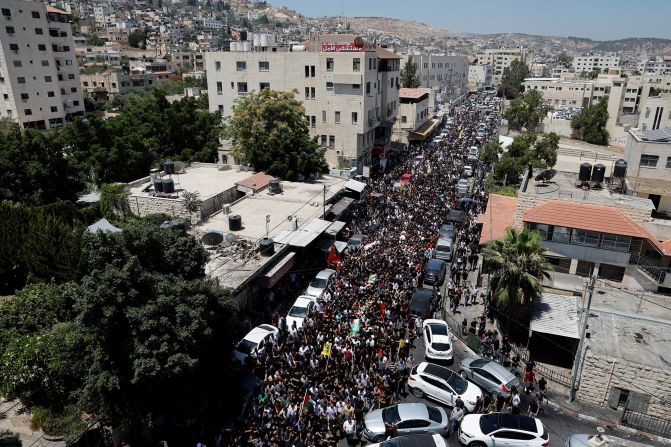 People attend the funeral of Palestinians who were killed during the Israeli military operation.