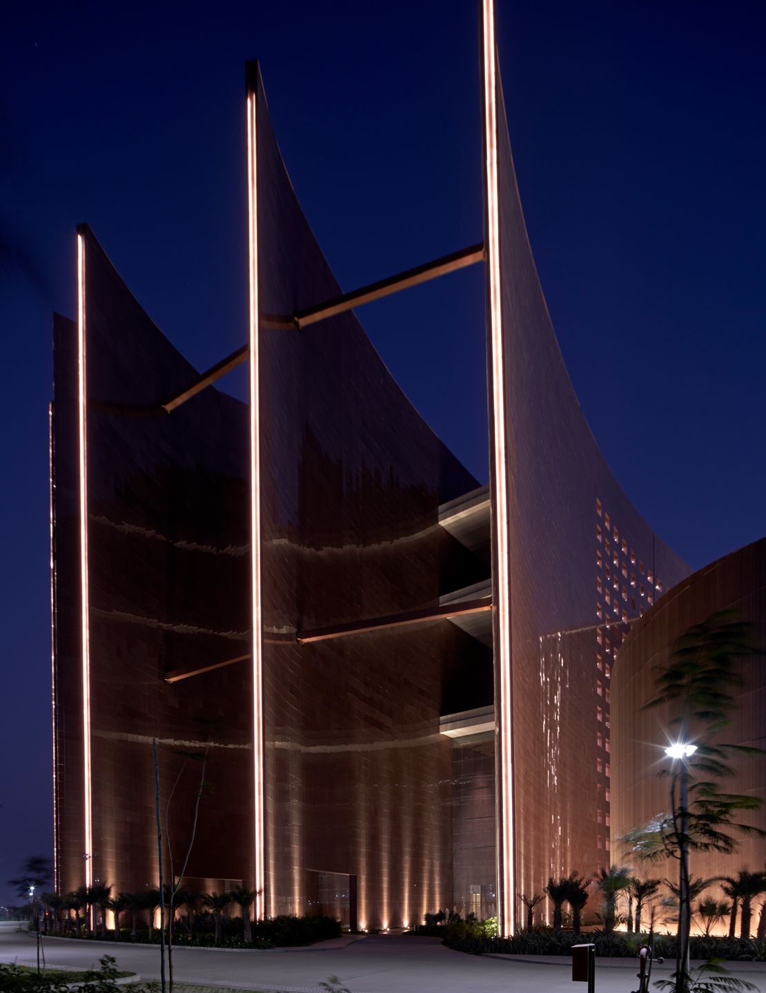 The structure's spine flares out at each end to funnel breeze through the building.