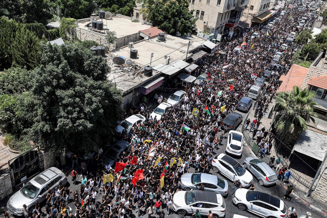 Mourners march in Jenin during Wednesday's funeral.
