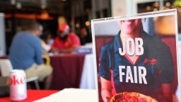 Job seekers speak with recruiters during a job fair at Navy Pier on April 11, 2023 in Chicago, Illinois. Companies at the fair were seeking mostly seasonal employees to work in tourism related fields. 