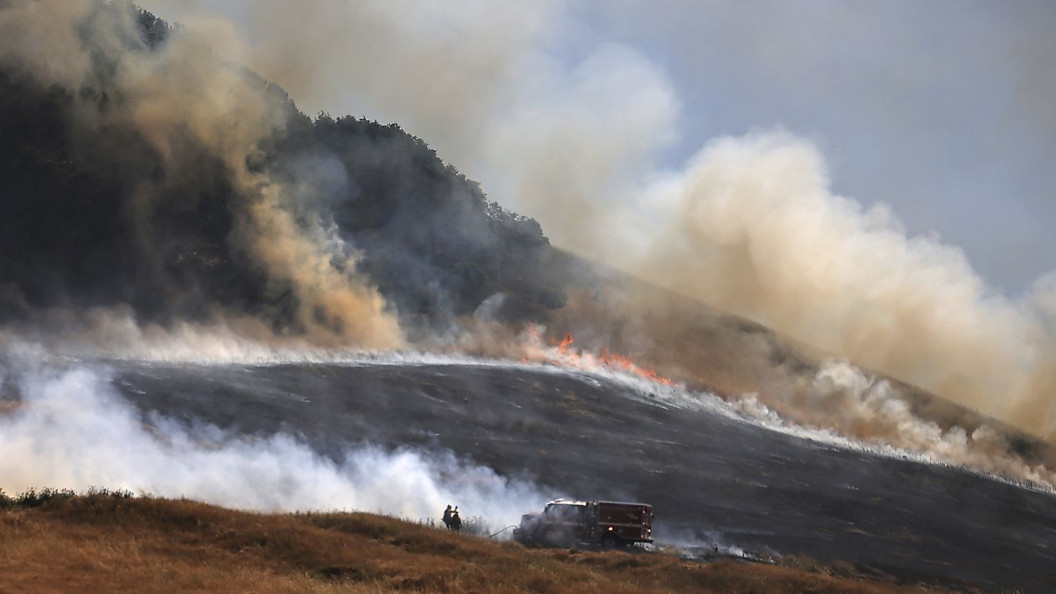 The San Antonio Fire spreads uphill west of Petaluma, California, on Friday. California experienced a heat wave during the long Fourth of July weekend.
