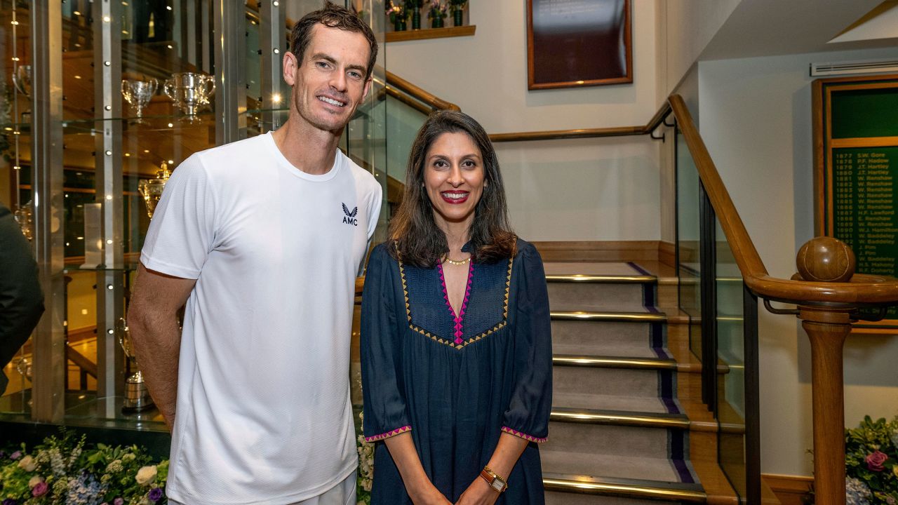Nazanin Zaghari-Ratcliffe poses for a photo with Britain's Andy Murray in the Clubhouse after his first round men's singles match on day two of the Wimbledon tennis championships in London, Tuesday, July 4, 2023.