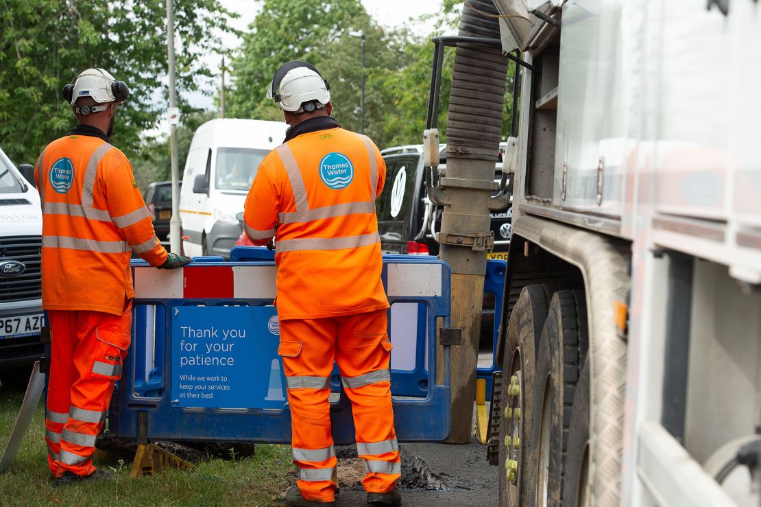 Thames Water employees fixing leaking pipes in Windsor, UK on July 5, 2023.