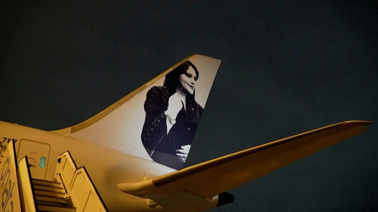 A view of a photograph of Iranian protester Mahsa Amini on the tail of the charter plane of the Brazilian women's football team, in Brisbane, Australia, July 4, 2023, in this still image taken from a handout video.