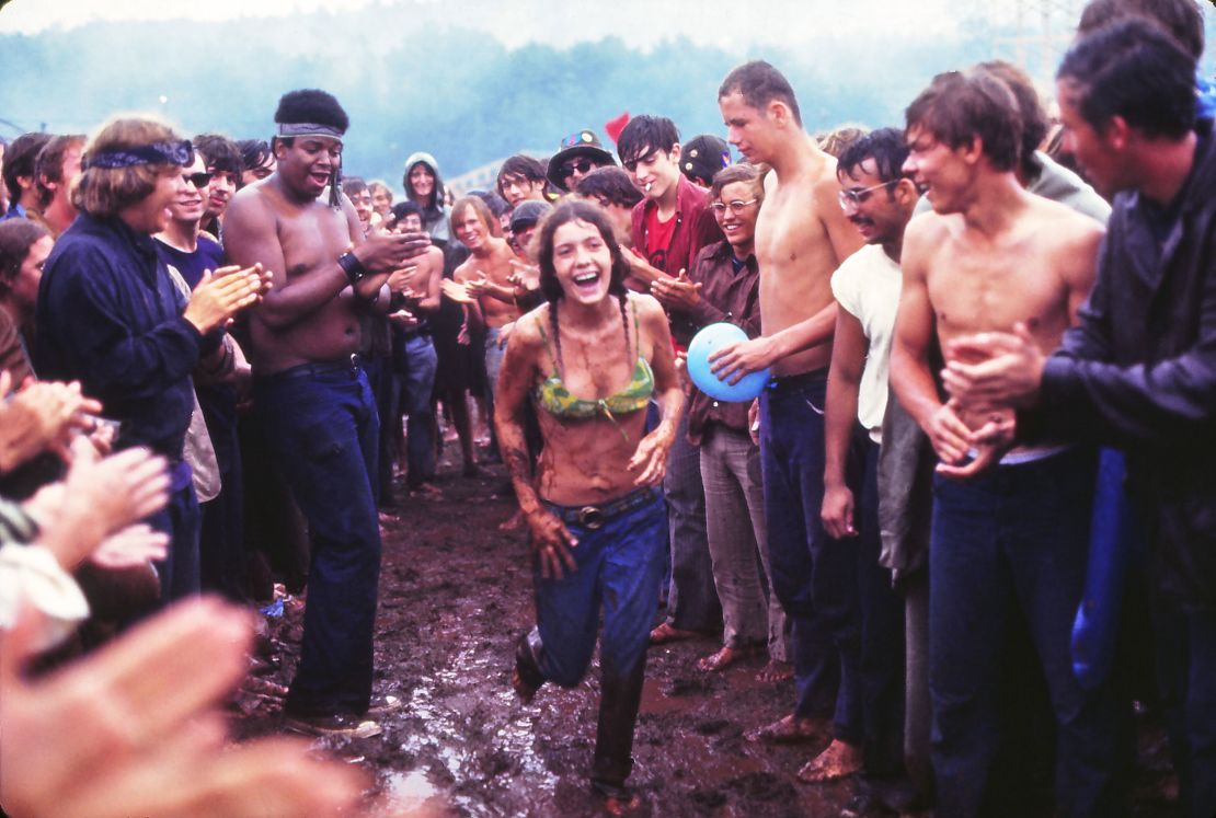 Woman running through the mud at the Woodstock Music Festival, New York, US, 17th August 1969. (Photo by Owen Franken/Corbis via Getty Images))