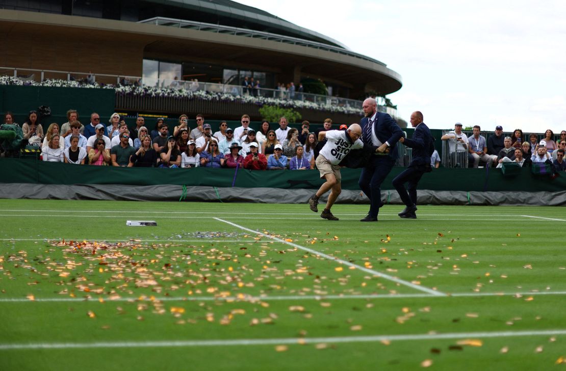 A Just Stop Oil protester disrupts a match at July's Wimbledon Championships. Sunak's ministers have been attempting to link the group to the Labour Party, which is on course to win the next election.