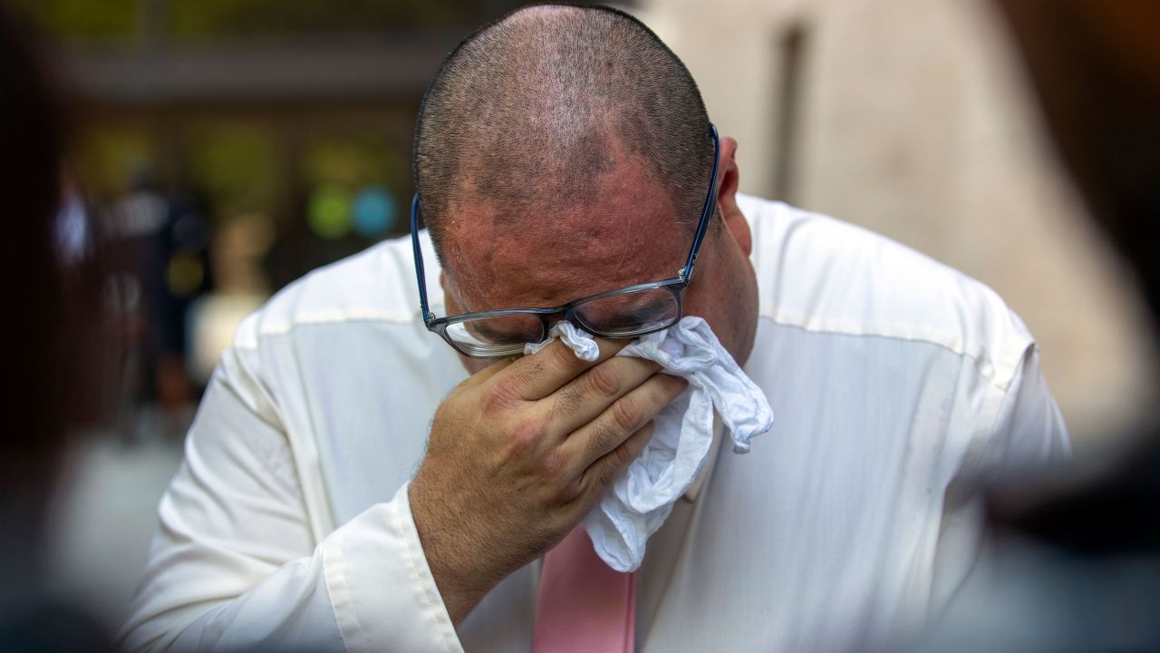 Paul Jamrowski, father of Jordan Anchondo and father in-law of Andre Anchondo, who both died in the 2019 mass shooting, breaks down in tears while speaking to the media outside the federal courthouse in El Paso, Texas on Wednesday.