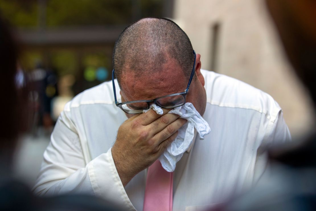 Paul Jamrowski, father of Jordan Anchondo and father in-law of Andre Anchondo, who both died in the 2019 mass shooting, breaks down in tears while speaking to the media outside the federal courthouse in El Paso, Texas on Wednesday.  