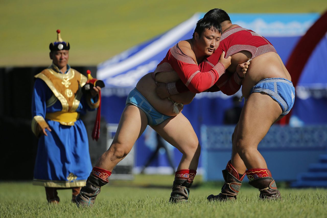 Mandatory Credit: Photo by Wu Hong/EPA/Shutterstock (8430301bm)
Mongolian People in Traditional Attire Wrestle During the 'Nomadic Festival-naadam' As Part of the 11th Asia-europe Meeting (asem) Summit of Heads of State and Government (asem11) in Ulan Bator Mongolia 15 July 2016 Mongolia Hosts the 11th Asem Summit of Heads of State and Government (asem11) in Its Capital City Ulan Bator From 15 to 16 July 2016 Mongolia Ulan Bator
Mongolia Asem Summit - Jul 2016