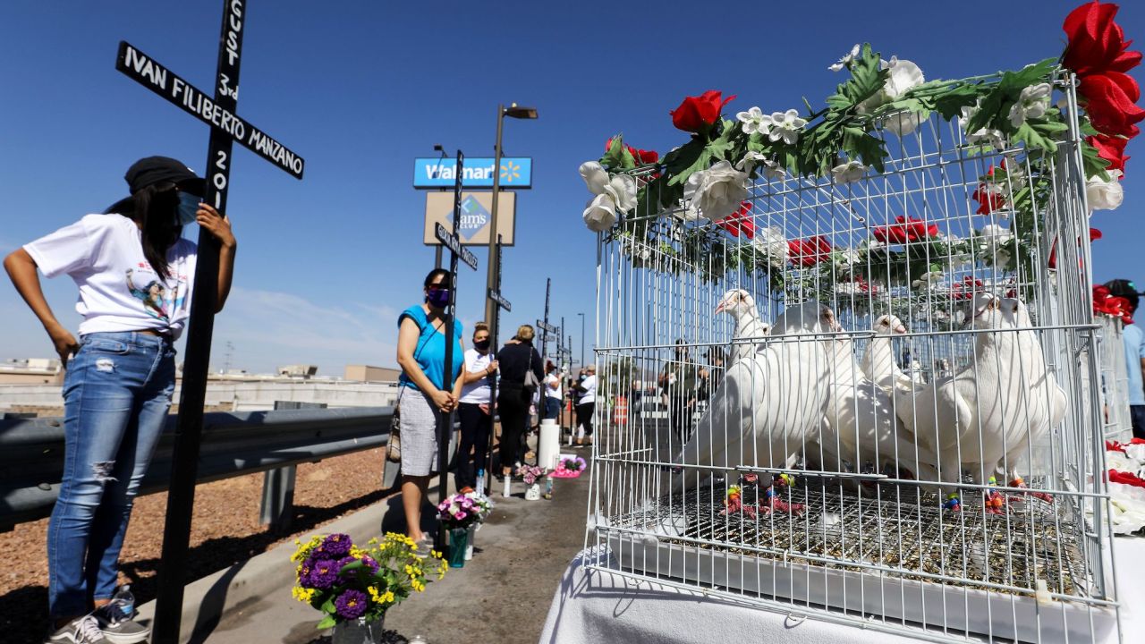 EL PASO, TEXAS - AUGUST 03: Twenty three doves await release as mourners hold crosses honoring those killed in the Walmart shooting which left 23 people dead in a racist attack targeting Latinos on August 3, 2020 in El Paso, Texas. Today marks the first anniversary of the deadliest attack against Hispanics in modern U.S. history. A number of memorial events are planned amid the COVID-19 pandemic in the Texas city which sits along the U.S.-Mexico border. (Photo by Mario Tama/Getty Images)