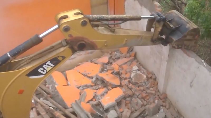 NextImg:India bulldozes home of man who allegedly urinated on tribal member in viral video | CNN