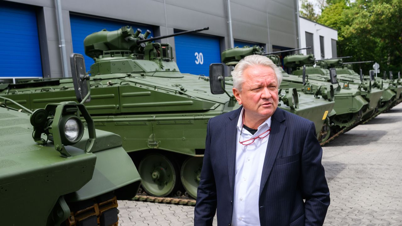 Armin Papperger, CEO of Rheinmetall, stands in front of reconditioned Marder infantry fighting vehicles during a tour of the firm's Unterluess plant in Lower Saxony, Germany on 14 July 2022. 
