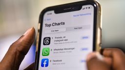 An employee downloads the newly unveiled Threads app on an iPhone at a design company in Chennai, India, 07 July 2023. Meta, the company behind Facebook and Instagram, said in a press release on 05 July 2023, that Mark Zuckerberg announced the initial version of 'Threads', an Instagram's text-based conversation app.