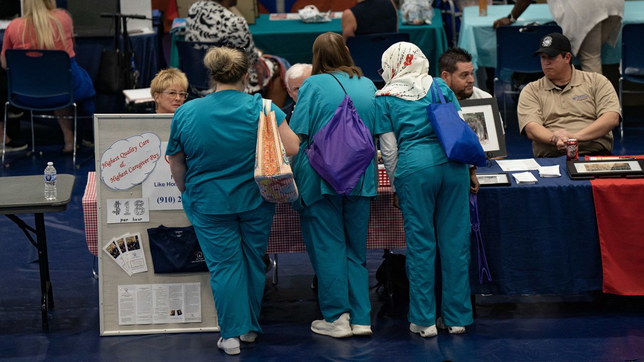 Attendees at a career fair at a community college in Bolivia, North Carolina, on Thursday, April 20, 2023.