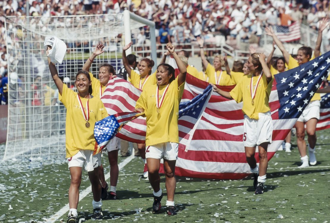 PASADENA, CA -  JULY 10:  Members of the USA Women's National Team celebrate winning the 1999 FIFA Women's World Cup following the final game played against China on July 10, 1999 at the Rose Bowl in Pasadena, California.  Visible players include Tiffany Roberts #5, Lorrie Fair #2, and Tisha Venturini #15.   (Photo by David Madison/Getty Images)