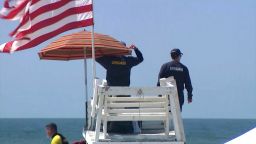 Lifeguards are seen monitoring Robert Moses beach in Babylon, New York, on July 4, 2023.