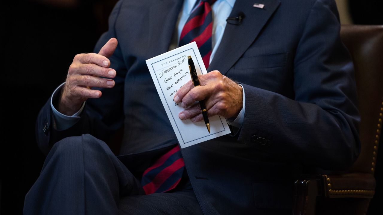 Biden holds his notes as he speaks with Zakaria.