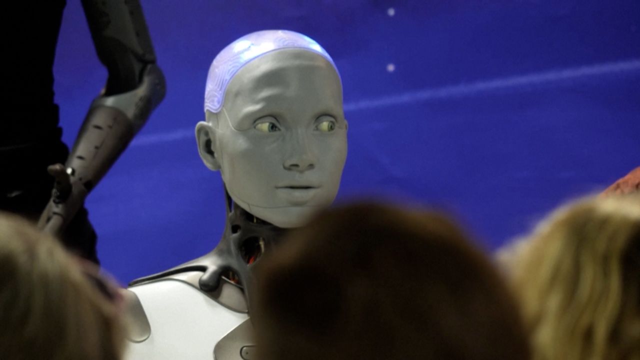 AI-powered humanoid robots field questions from reporters