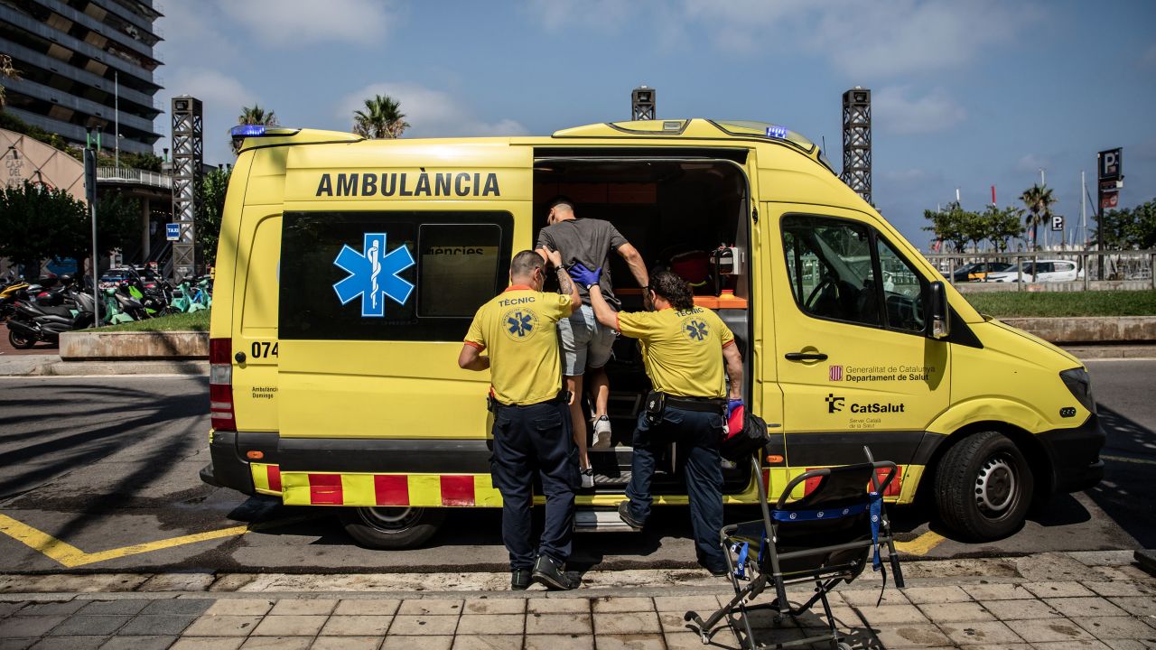 Paramedics help a patient into an ambulance during a heat wave in Barcelona, Spain, on Monday, July 18, 2022. 
