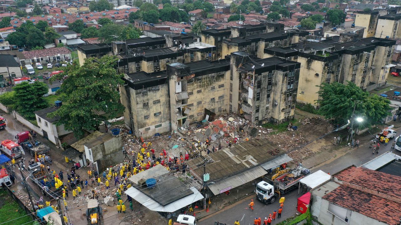 Rescue workers look for victims among the debris of a building collapse in Recife, in Brazil's Pernambuco state, July 7, 2023.