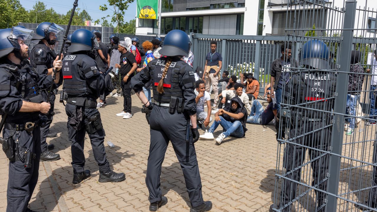 Police officers surrounded a group of people before the start of the Eritrea Festival in Giessen, Germany, on July 8, 2023.