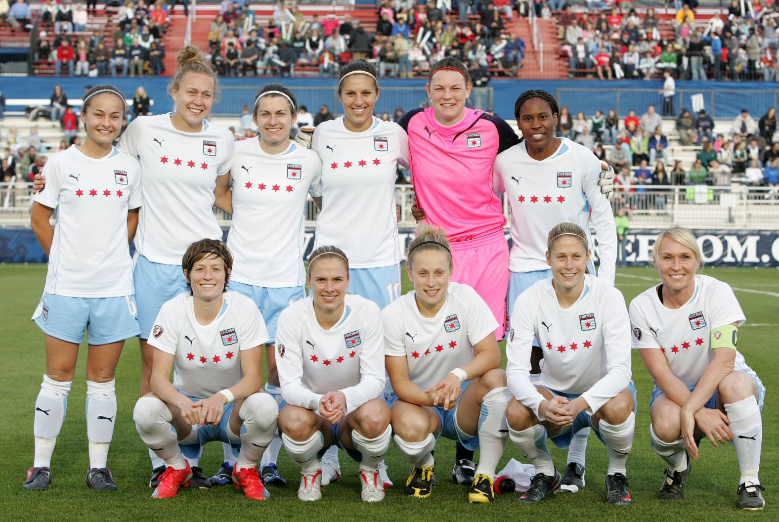 Rapinoe, front left, poses for a photo with her Chicago teammates before a match against the Washington Freedom in 2009.