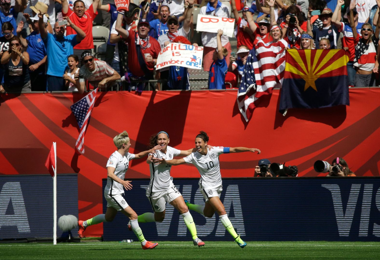 From left, Rapinoe, Lauren Holiday and Carli Lloyd celebrate Lloyd's second goal during the 2015 World Cup championship match against Japan, on their way to winning the title.