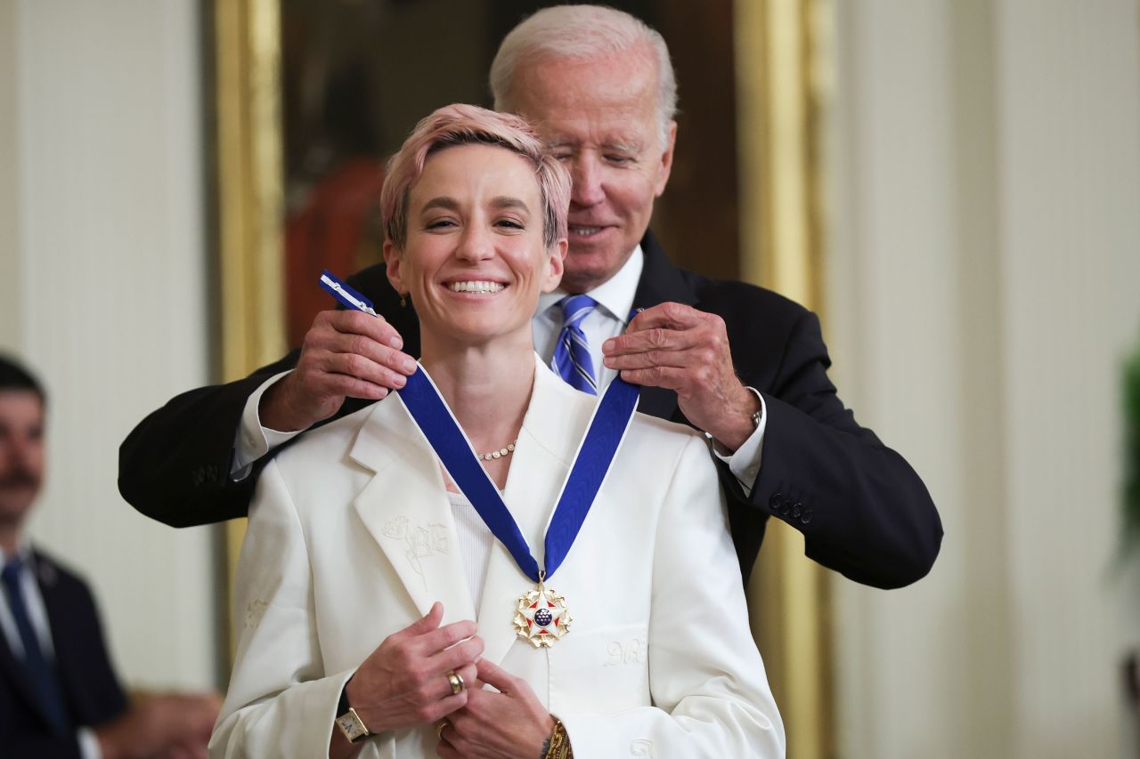 President Joe Biden <a href="https://www.cnn.com/2022/07/07/politics/biden-presidential-medal-of-freedom/index.html" target="_blank">presents the Presidential Medal of Freedom to Rapinoe</a> at the White House in July 2022. She became the first female soccer player to receive the award.