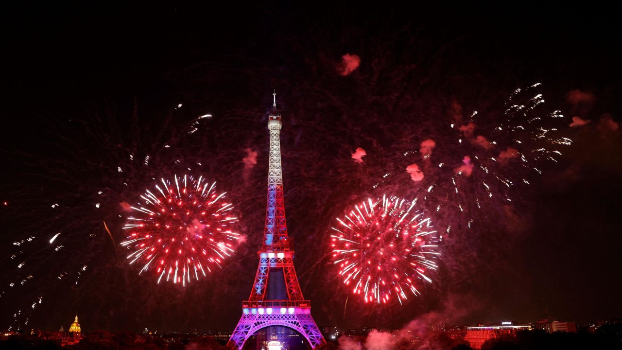 Fireworks explode above the Eiffel Tower as part of the annual Bastille Day celebrations in Paris, on July 14, 2022.