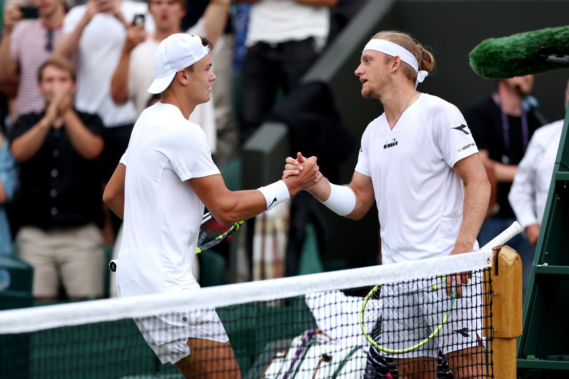 Holger Rune of Denmark interacts with defeated Alejandro Davidovich Fokina of Spain at the net after their Men's Singles third round match during day six of The Championships Wimbledon 2023 at All England Lawn Tennis and Croquet Club on July 08, 2023 in London, England.